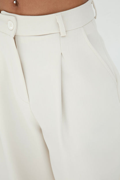 Gaiia Pleated Carrot Trousers